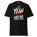 A black short-sleeve t-shirt with a bold graphic on the front reading 'YEAH YOU DO.' in white and red graffiti-style lettering, with a small crown graphic above the text.
