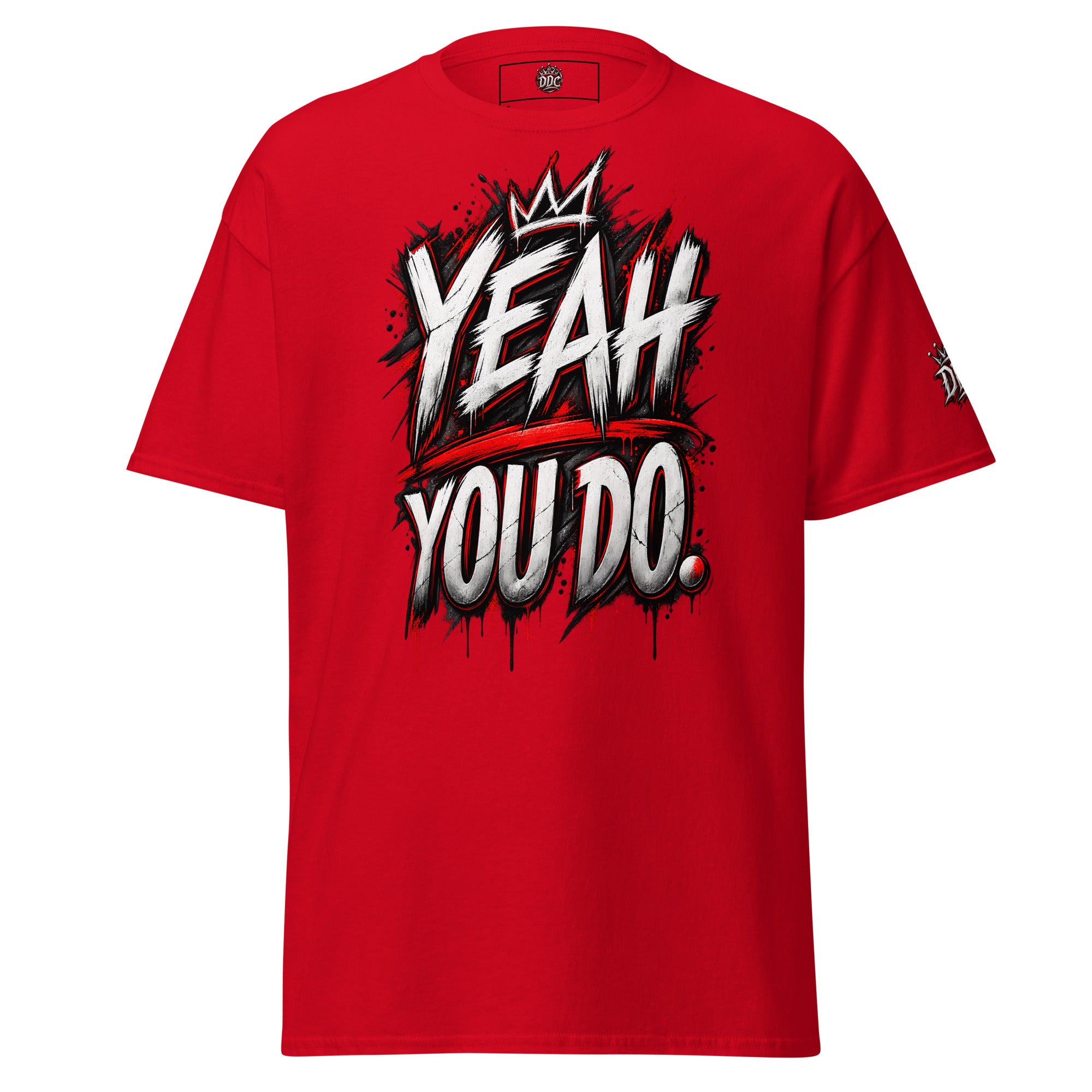 A red short-sleeve crewneck t-shirt featuring a bold graphic on the front with the text 'YEAH YOU DO.' in a white and black graffiti-style font with a red crown accent, shown against a plain white background.