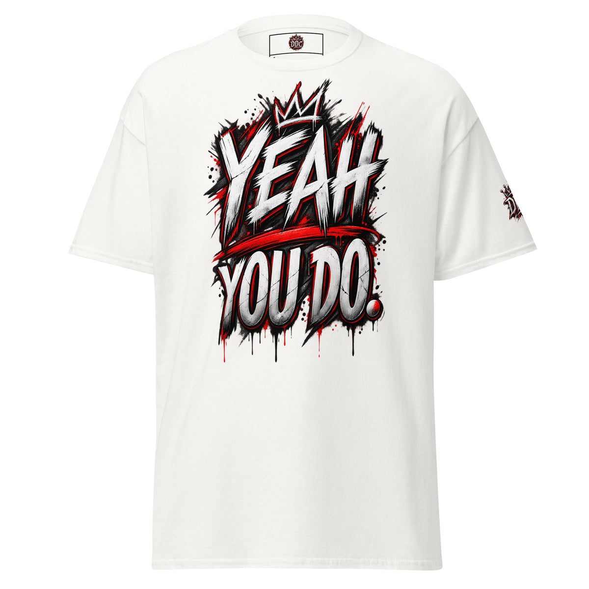 A white short-sleeve t-shirt with a bold graphic on the chest reading 'YEAH YOU DO.' in a graffiti-style font with red paint splatters and drips.