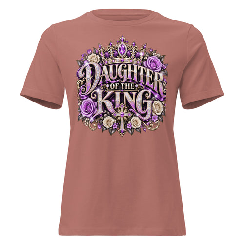 A dusty rose short-sleeve t-shirt with a large graphic on the chest reading 'Daughter of the King' in stylized purple and beige lettering, decorated with a crown, roses, and a cross, shown on a plain white background.