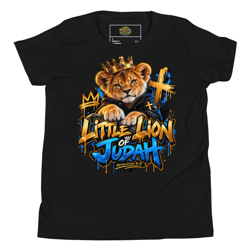 A black short-sleeve t-shirt with a colorful graphic print of a lion cub wearing a gold crown and a blue robe, with the text 'Little Lion of Judah' in a graffiti-style font. The shirt is displayed flat against a white background.